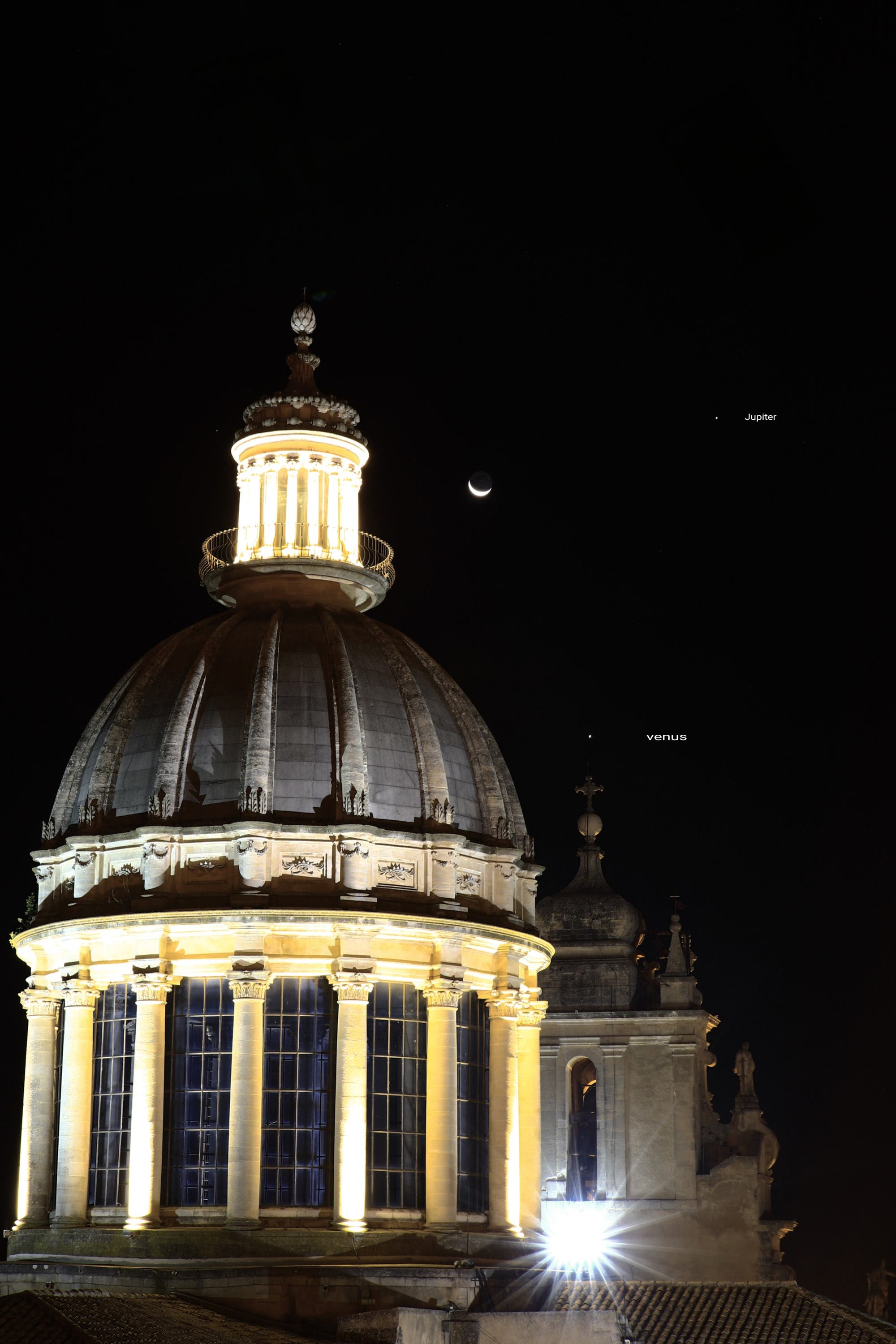 Conjunction Moon, Venus, Jupiter above cathedral Ragusa ibla, Italy Sicily 