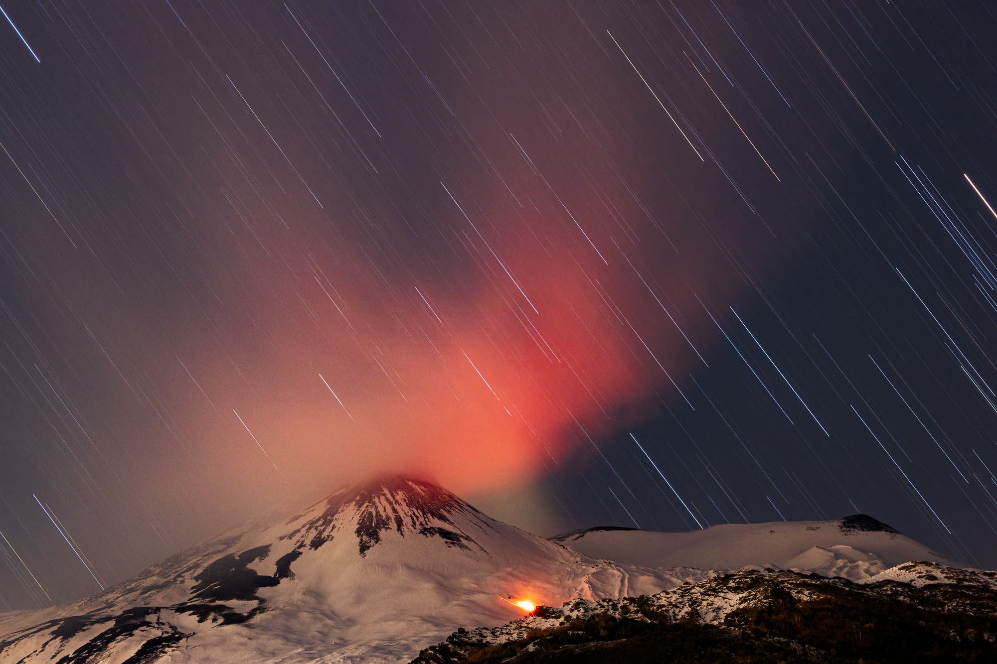 Star trails over mount Etna