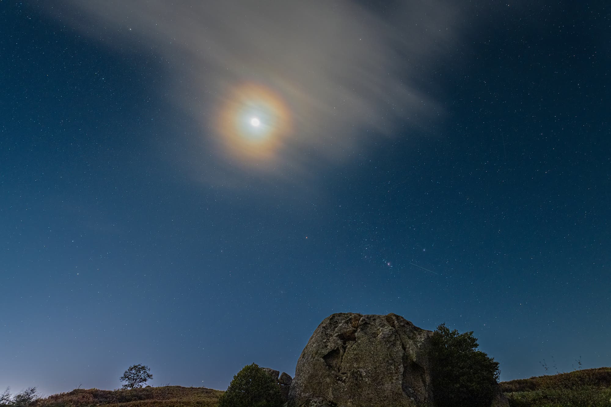 The return of Orion the Hunter and a lunar corona over megaliths