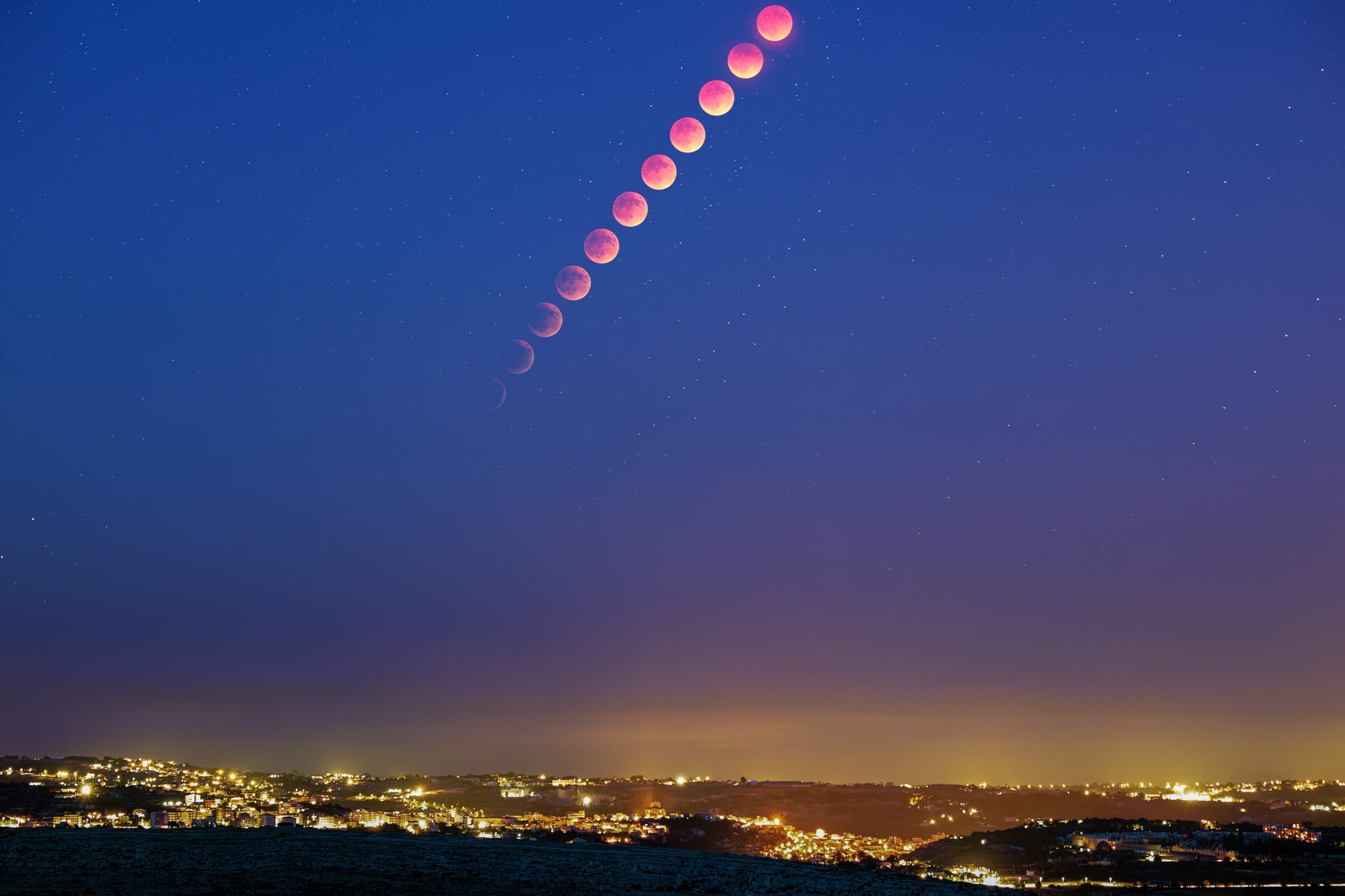 The eclipsed moon rising
