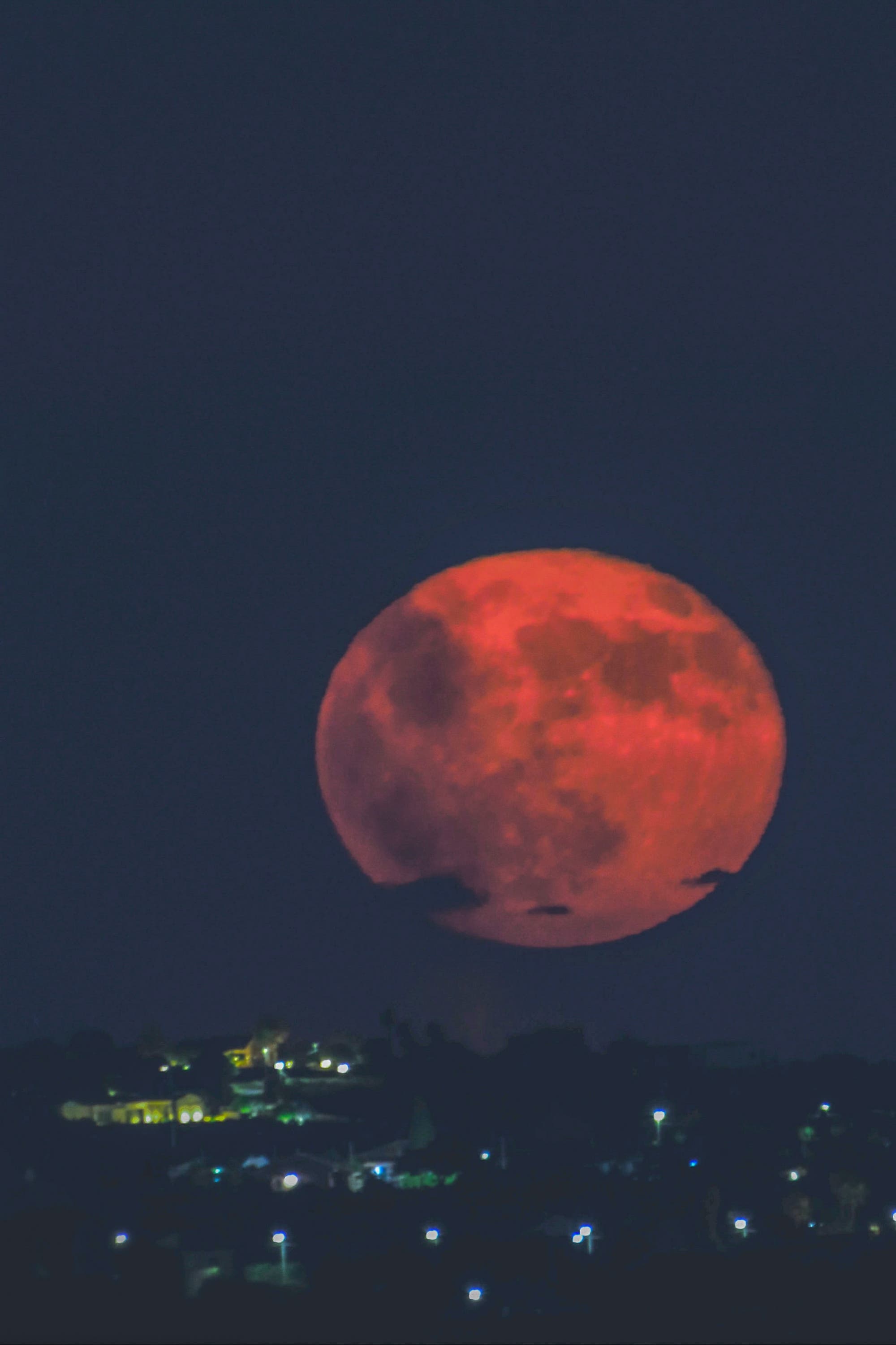 New shot - Buck moon rises over the city of Modica Italy Sicily 