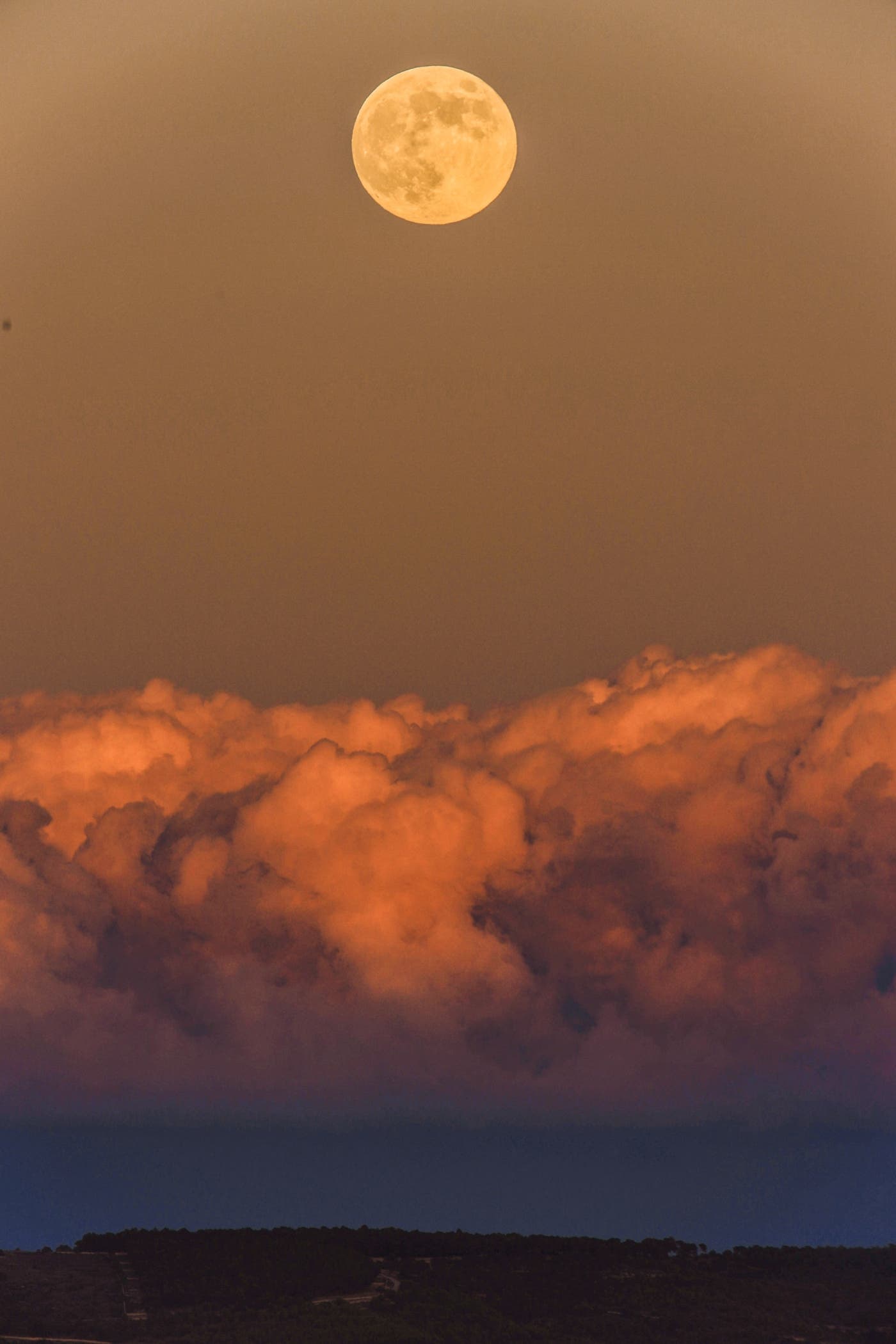 Sunset light reflecting on the Moon and clouds, Castelluccio, Modica - Sicily 