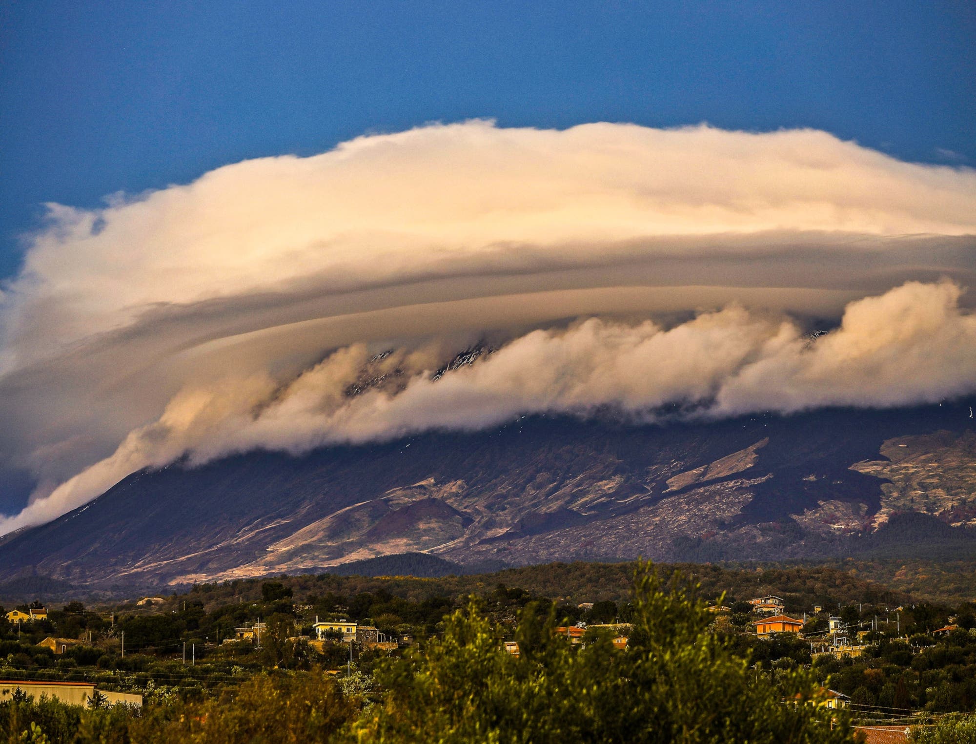 Giant Lenticular clouds above Etna volcano Etna Sicily 