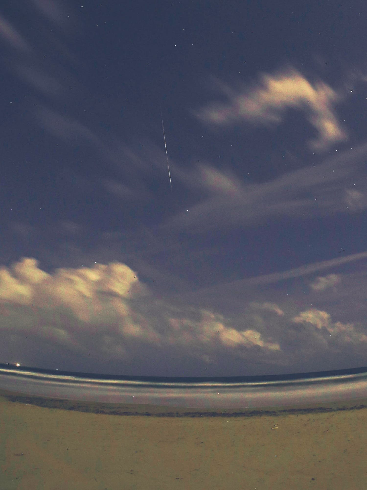 Two meteors geminids above the coast Porto Ulisse Sicily 