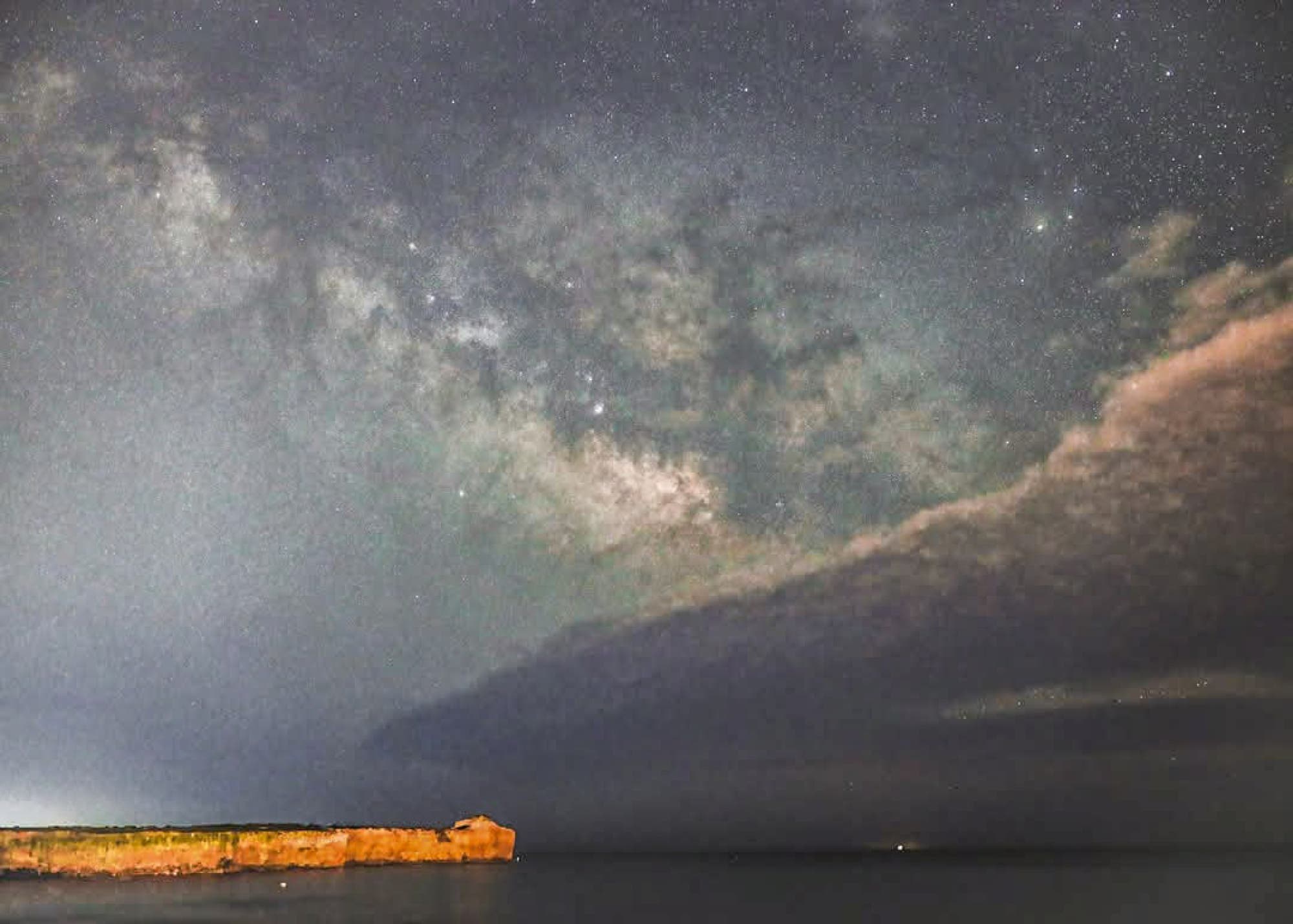 Great milky way rising above the coast Porto Ulisse Italy 