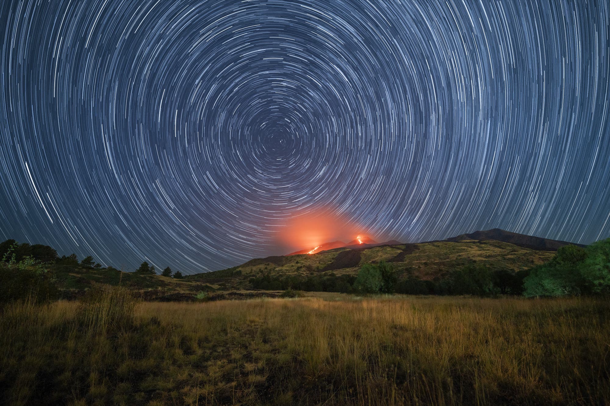 Star trails on Mount Etna with a double lava flow