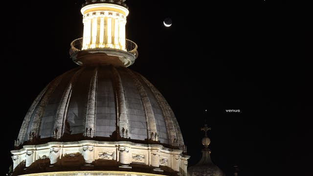 Conjunction Moon, Venus, Jupiter above cathedral Ragusa ibla, Italy Sicily 