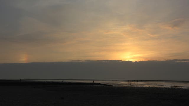 Nebensonne über dem Wattenmeer bei Cuxhaven