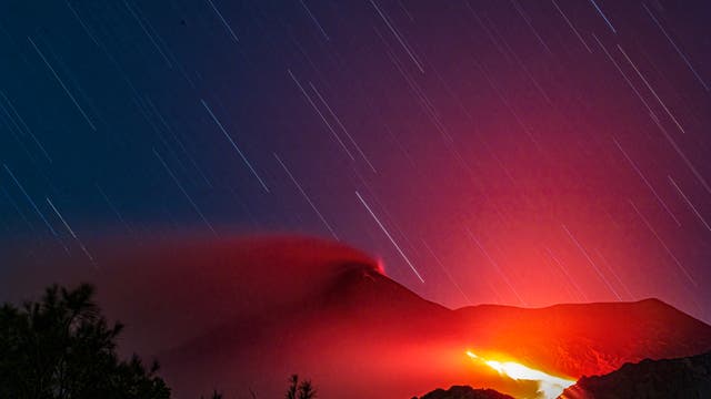 A dramatic star trail over the lava flow