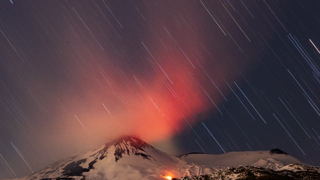 Star trails over mount Etna