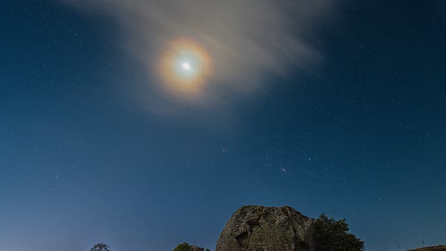 The return of Orion the Hunter and a lunar corona over megaliths
