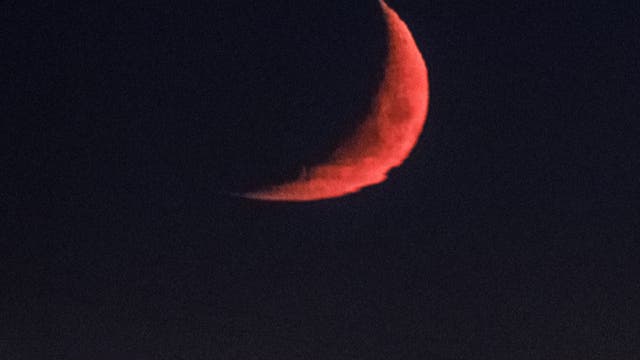 Moonset with inferior mirage Ragusa Italy Sicily 