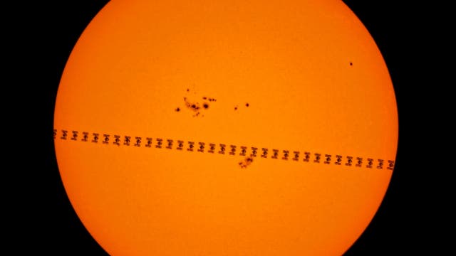 The International Space Station transits the Sun