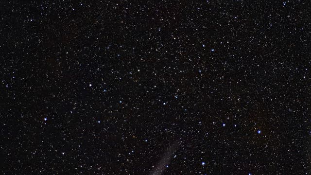 Die Galaxie  und der Komet