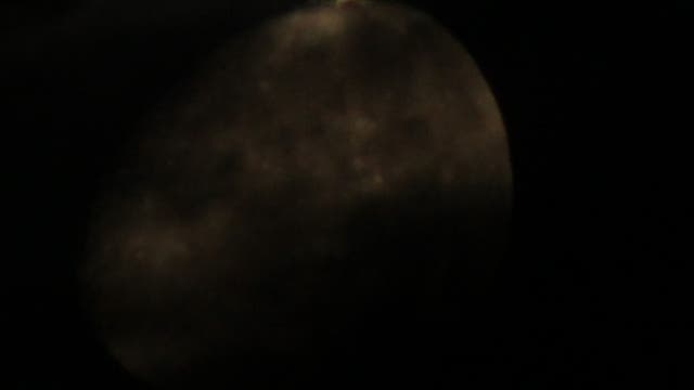 Mond hinter Wolken mit Alkyone