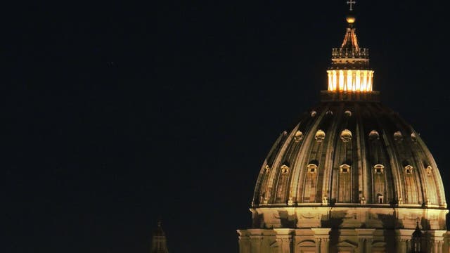 Thin Moon above St. Peter Basilica in Rome