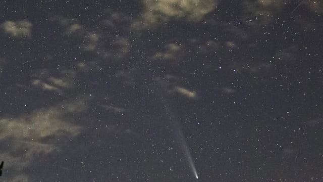 The great Comet Atlas setting on the volcano Etna MT 2000 