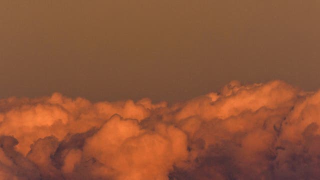 Sunset light reflecting on the Moon and clouds, Castelluccio, Modica - Sicily 