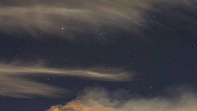 Wonderful new etna eruption with iridescent cloud over Mount Etna 