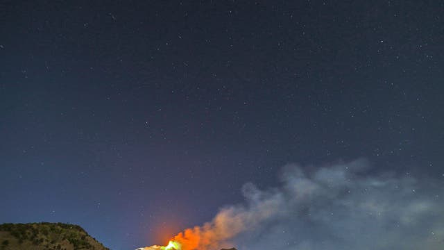 Smoke ring formation during eruption above Mount Etna