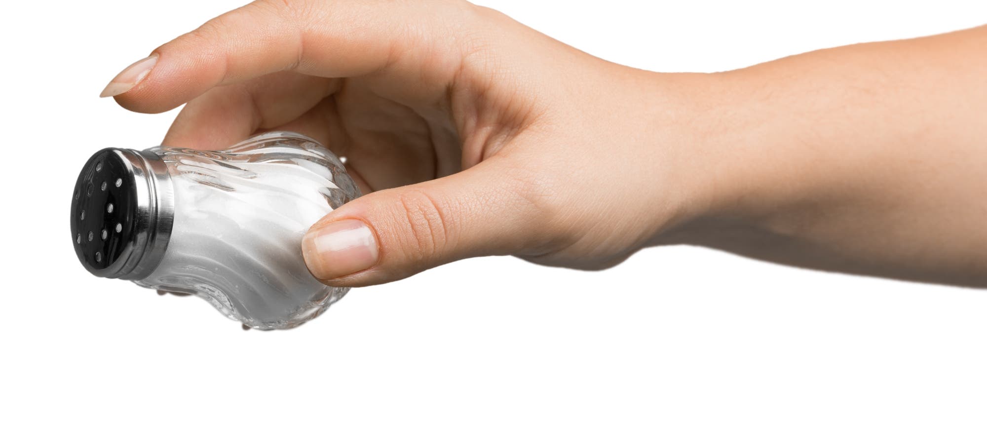 Hand mit Salzstreuer Hand mit Salzstreuer