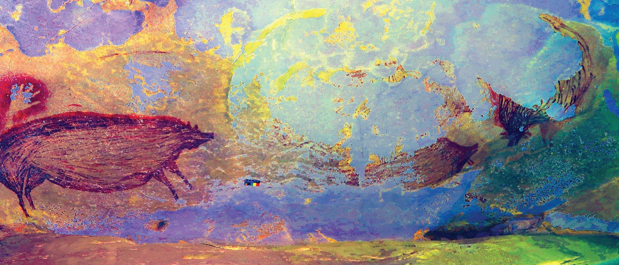 Aufnahme in Falschfarben von Pustelschweinen an einer Höhlenwand auf Sulawesi. Das Alter: 45500 Jahre.
