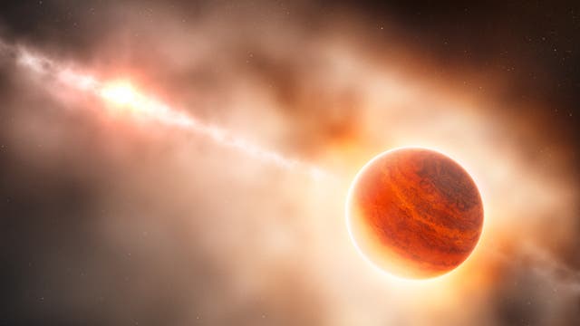 So kann man sich die Entstehung eines jupiterähnlichen Planeten in der dichten Scheibe aus Gas und Staub um den Stern HD 100546 vorstellen. Der junge Planet sammelt noch Materie auf und wird dabei stark aufgeheizt, so dass er rot glüht.