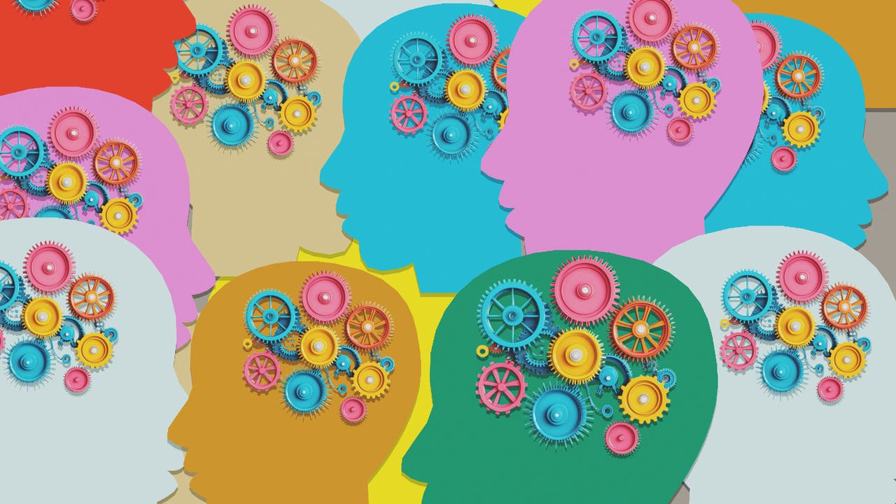 Mehrere bunte Silhouetten von Köpfen, die sich überlappen, mit Zahnrädern in verschiedenen Farben im Bereich des Gehirns. Die Zahnräder symbolisieren Denken und Kreativität. Das Bild vermittelt den Eindruck von Teamarbeit und Innovation.