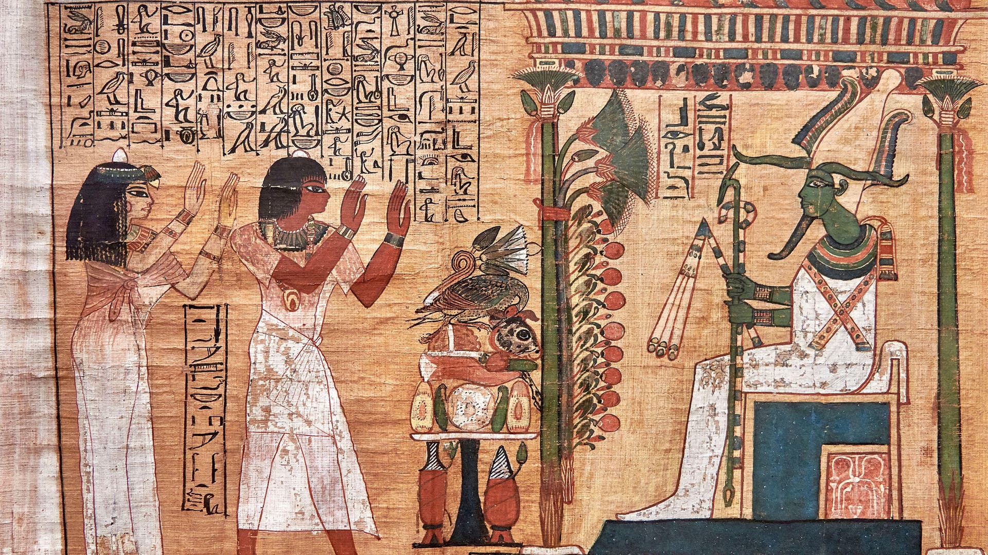 Dieser Papyrus aus dem Grab zeigt Cha und seine Frau Merit bei der Anbetung des Herrschers des Jenseits, Osiris.
