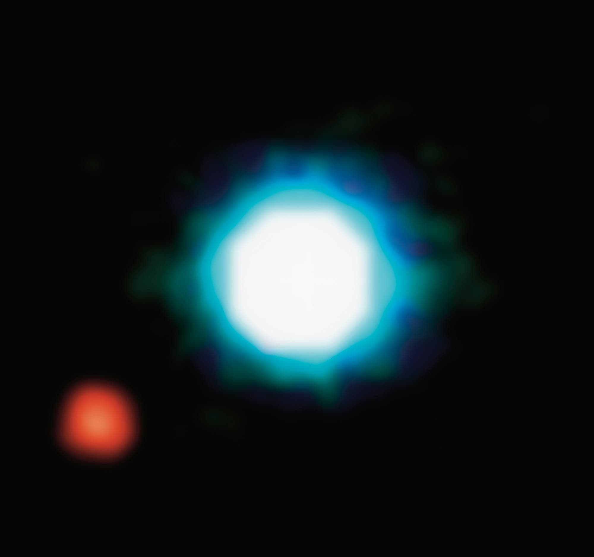 Das erste direkte Bild eines Exoplaneten (links), der einen Braunen Zwerg (rechts) umkreist