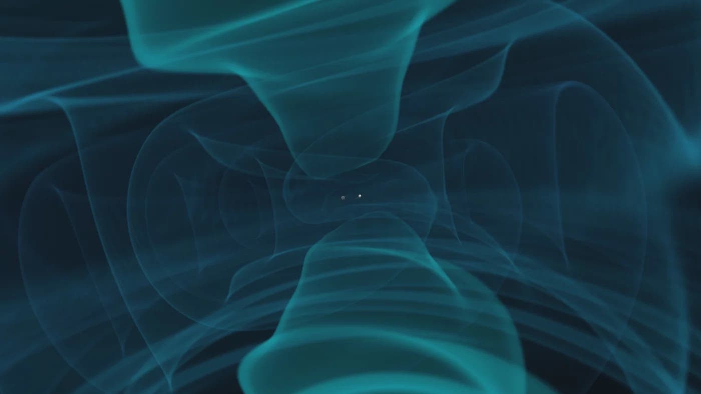 En el centro de la imagen simulada y mostrada puede ver dos bolas que deben representar dos agujeros negros buscando. Lanzan ondas gravitacionales en el área que pueden verse como ondas azul turquesas.