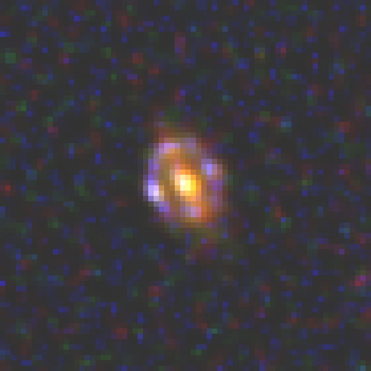 Die Gravitationslinse J1000+0221 (Aufnahme des Weltraumteleskops Hubble)