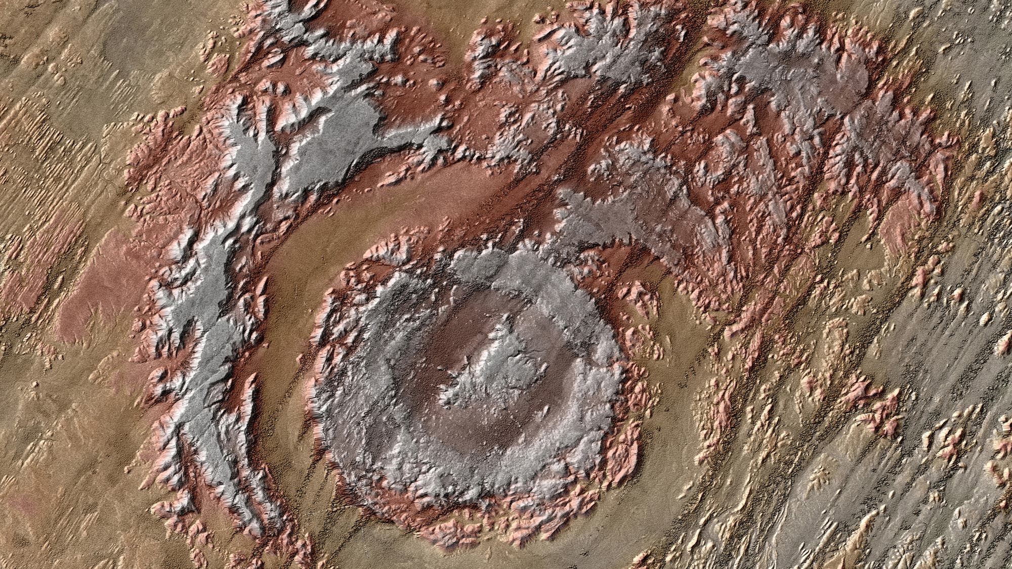 Die Aorounga-Struktur im nordafrikanischen Tschad entspricht auf den ersten Blick nur teilweise dem typischen Bild eines Einschlagkraters, denn die Spuren des kosmischen Treffers verwitterten im Laufe der Zeit beträchtlich.