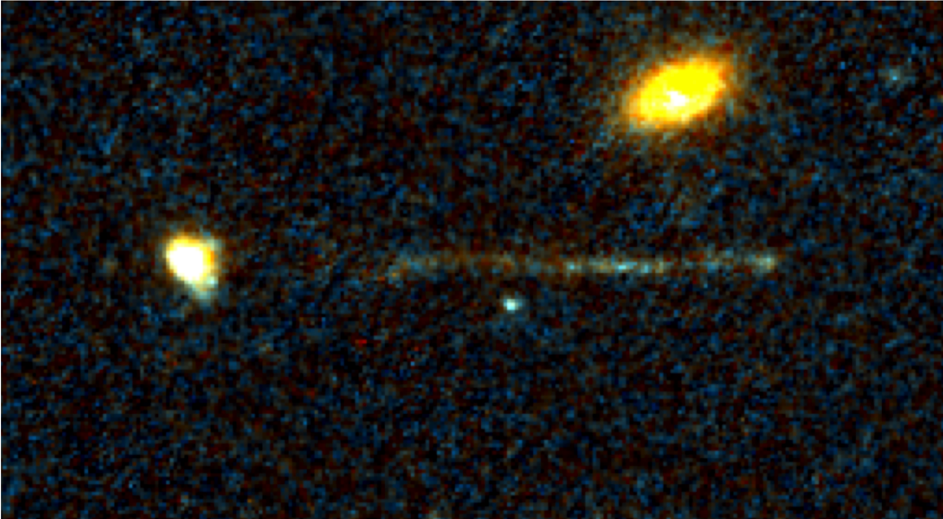 Die Aufnahme des Weltraumteleskops Hubble zeigt zwei kompakte Galaxien und einen auffälligen Streifen junger Sterne