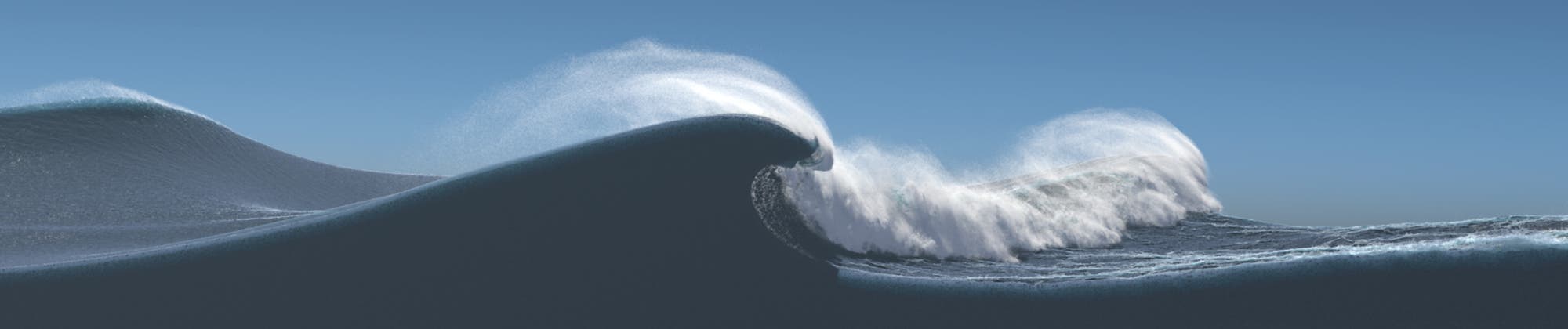 Eine große Meereswelle bricht unter einem klaren blauen Himmel. Die Welle ist in Bewegung, mit Gischt, die von der Spitze spritzt.