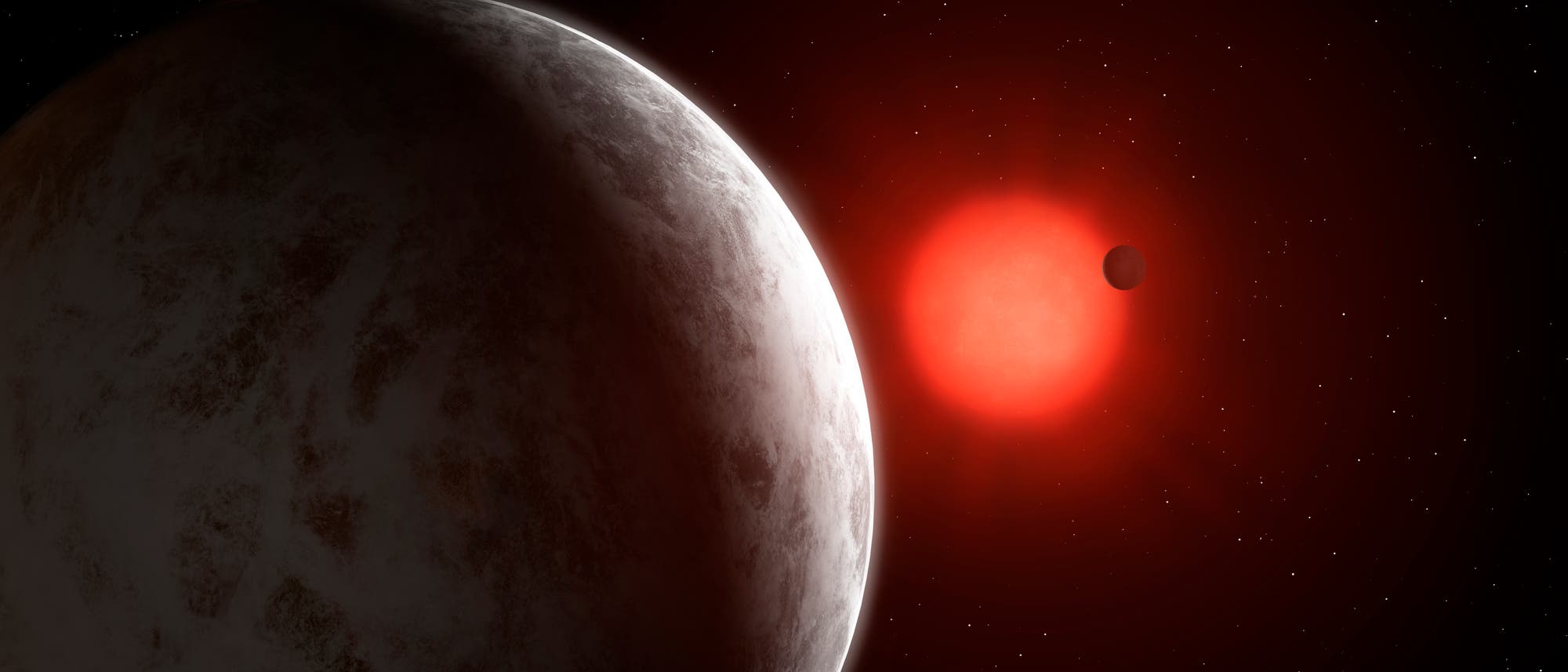 Zwei - oder womöglich drei - Planeten kreisen um Gliese 887 (künstlerische Darstellung)