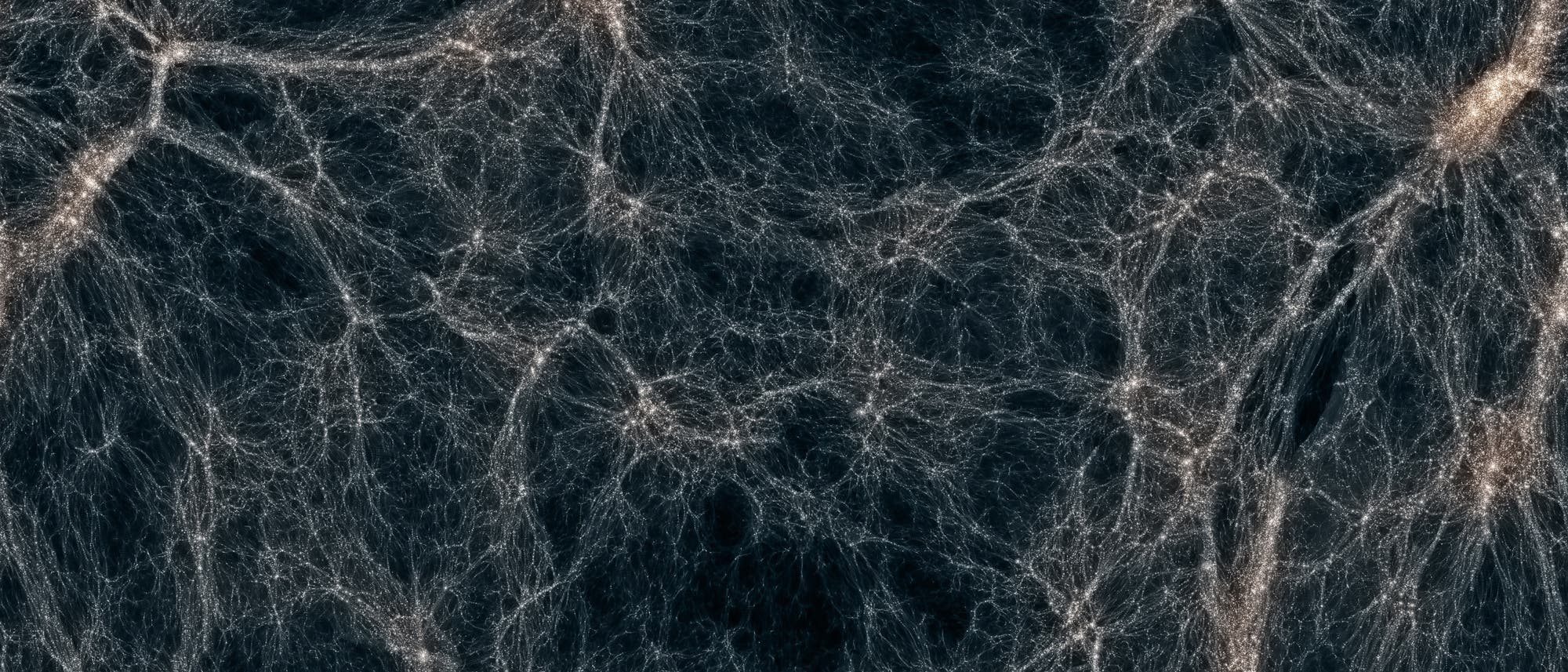 Darstellung des kosmischen Netzwerks im Universum. Die Abbildung zeigt ein komplexes Geflecht aus leuchtenden Filamenten und Knotenpunkten, die Galaxien und Materieansammlungen repräsentieren. Dunkle Bereiche dazwischen symbolisieren leeren Raum. Diese Struktur veranschaulicht die großräumige Verteilung von Materie im Kosmos.