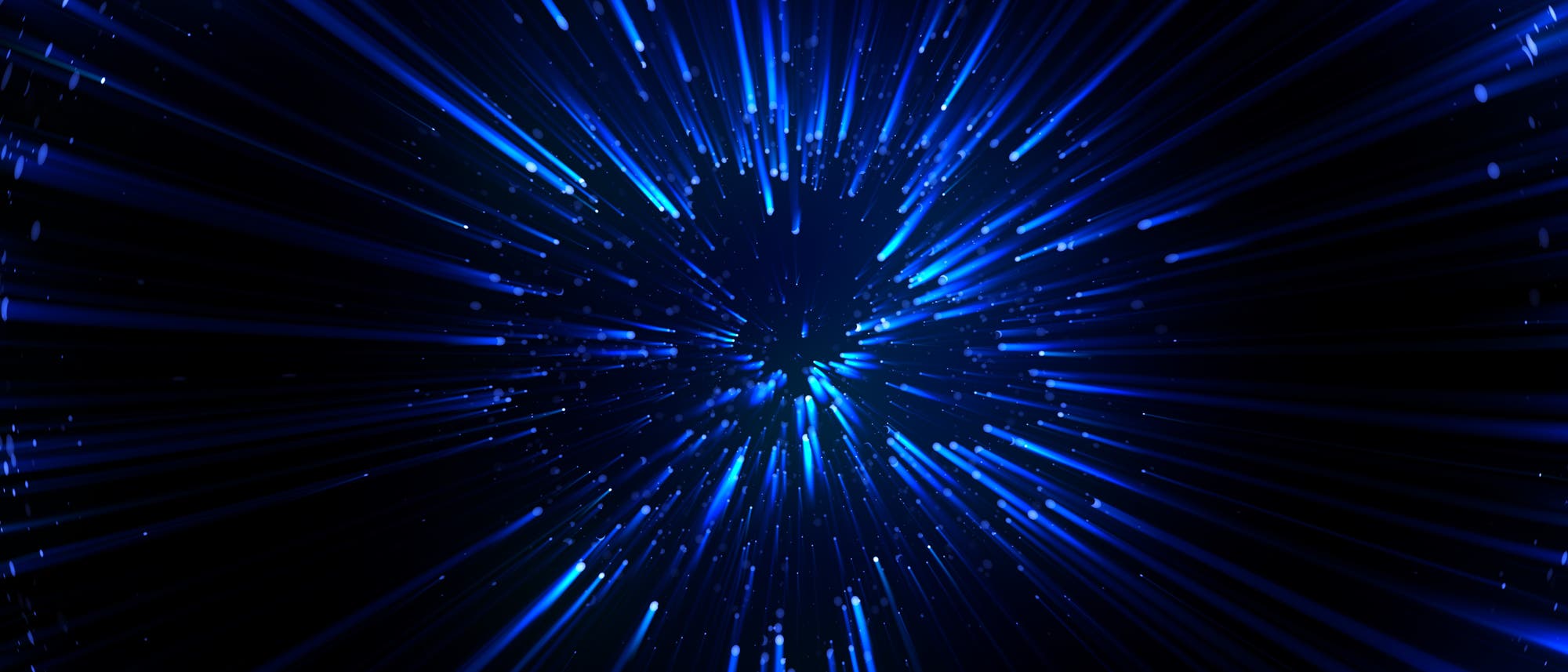 Symbolbild: Neutrinos als blaue Lichtreflexe vor schwarzem Hintergrund