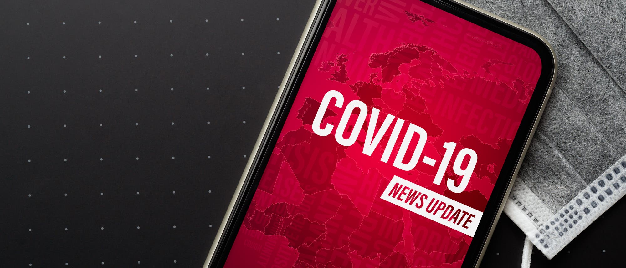 Smartphone mit Covid-19-News