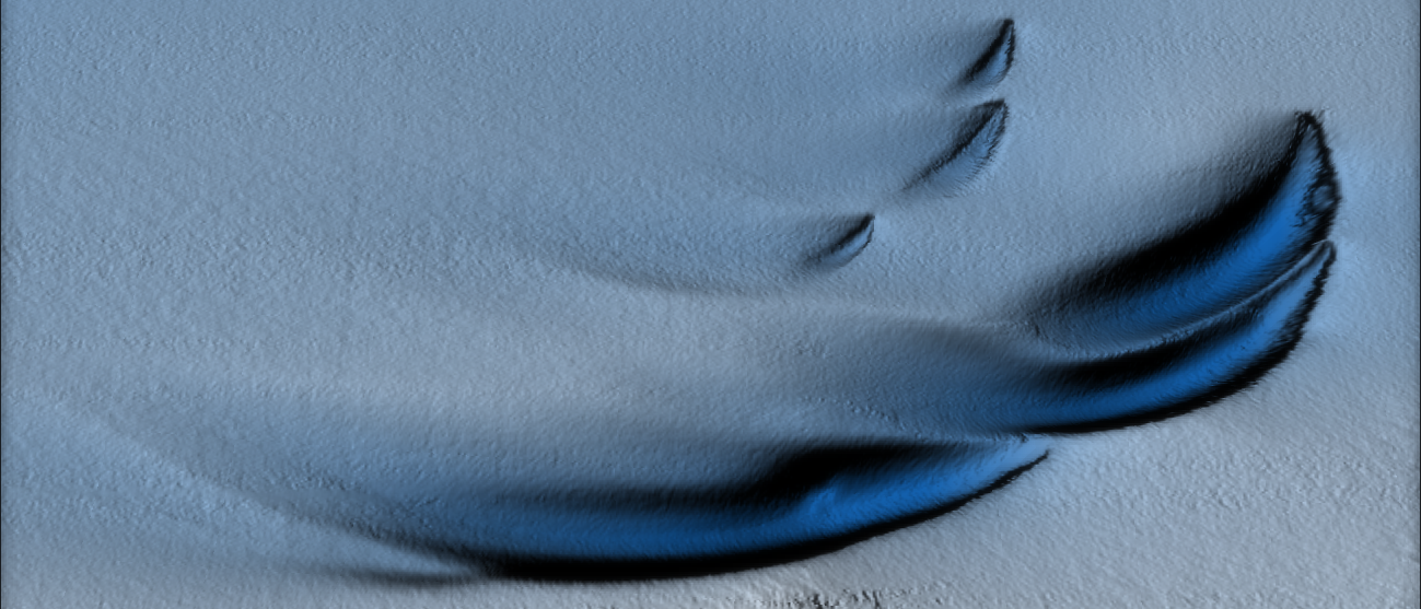 Eine Visualisierung zeigt dunkelblaue Formationen auf einer weißen Eislandschaft, die wie Tränen oder Sanddünen geformt sind.