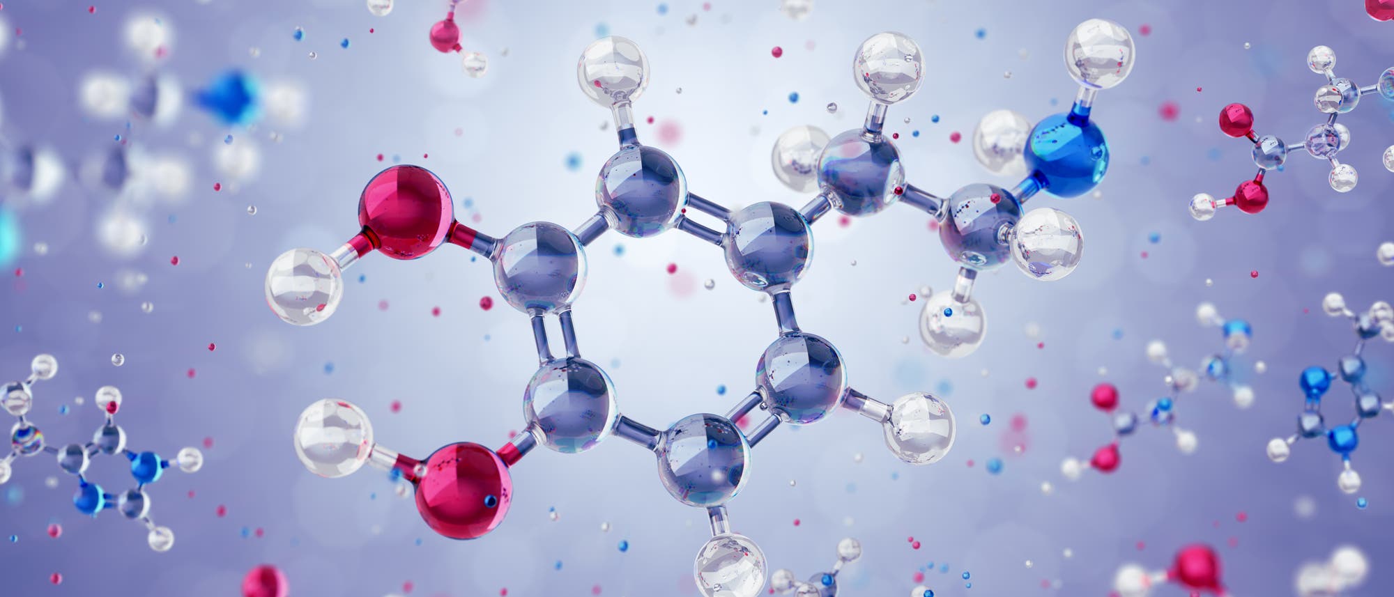 Glitzernde Darstellung der chemischen Molekülstruktur des Neurotransmitters Dopamin. Der Hintergrund ist verschwommen und in einem sanften Violett gehalten, was den Fokus auf die Molekülstruktur lenkt.