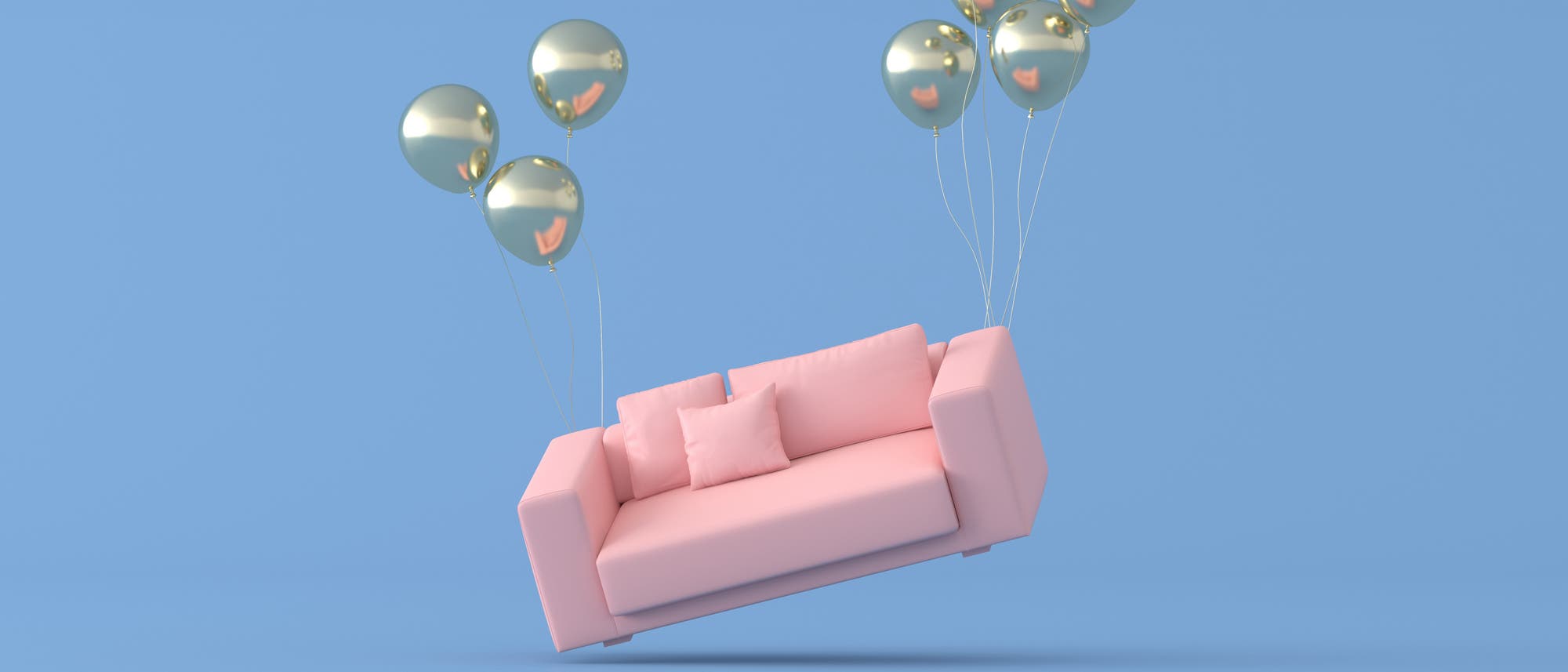 Ein Sofa, das an Ballons schief in der Luft hängt