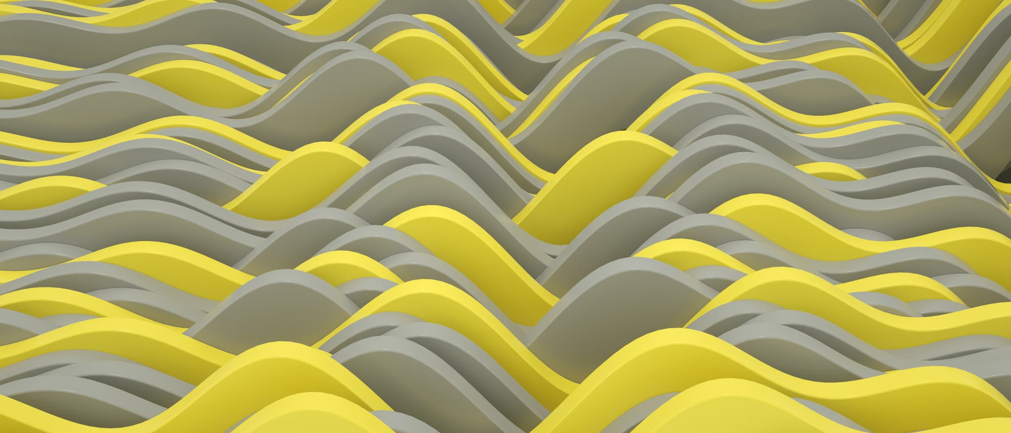 Eine abstrakte Darstellung von wellenförmigen Strukturen in gelben und grauen Tönen. Die Wellen verlaufen diagonal über das Bild und erzeugen ein dynamisches, rhythmisches Muster. Die geschwungenen Formen und die kontrastierenden Farben verleihen dem Bild eine dreidimensionale Wirkung, die an sanfte Hügel oder Wellen erinnert.
