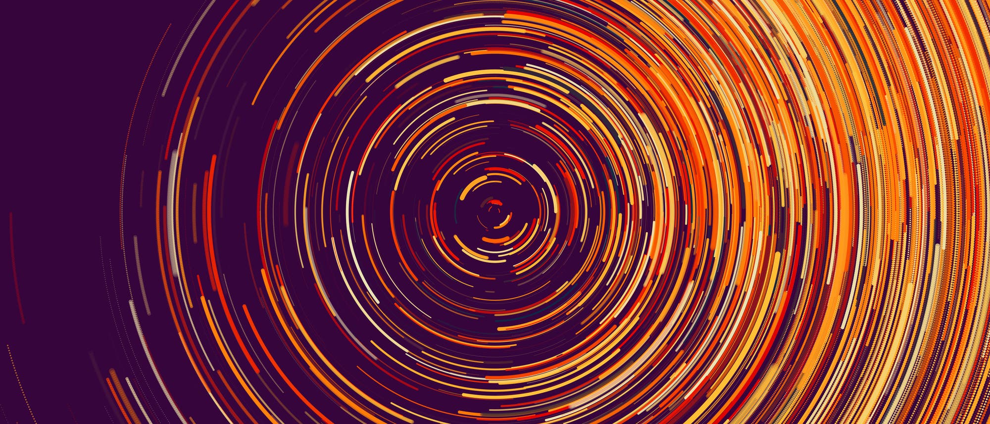 Eine abstrakte Darstellung von konzentrischen Kreisen in leuchtenden Gelb-, Orange- und Rottönen auf einem dunklen Hintergrund. Die Kreise bestehen aus kurzen, farbigen Linien, die eine spiralförmige Bewegung andeuten. Dieses Bild erinnert an die Bewegung von Sternen am Nachthimmel und vermittelt ein Gefühl von Dynamik und Energie. Es könnte als künstlerische Interpretation astronomischer Phänomene dienen. Eine abstrakte Darstellung von konzentrischen Kreisen in leuchtenden Gelb-, Orange- und Rottönen auf einem dunklen Hintergrund. Die Kreise bestehen aus kurzen, farbigen Linien, die eine spiralförmige Bewegung andeuten. Dieses Bild erinnert an die Bewegung von Sternen am Nachthimmel und vermittelt ein Gefühl von Dynamik und Energie. Es könnte als künstlerische Interpretation astronomischer Phänomene dienen.