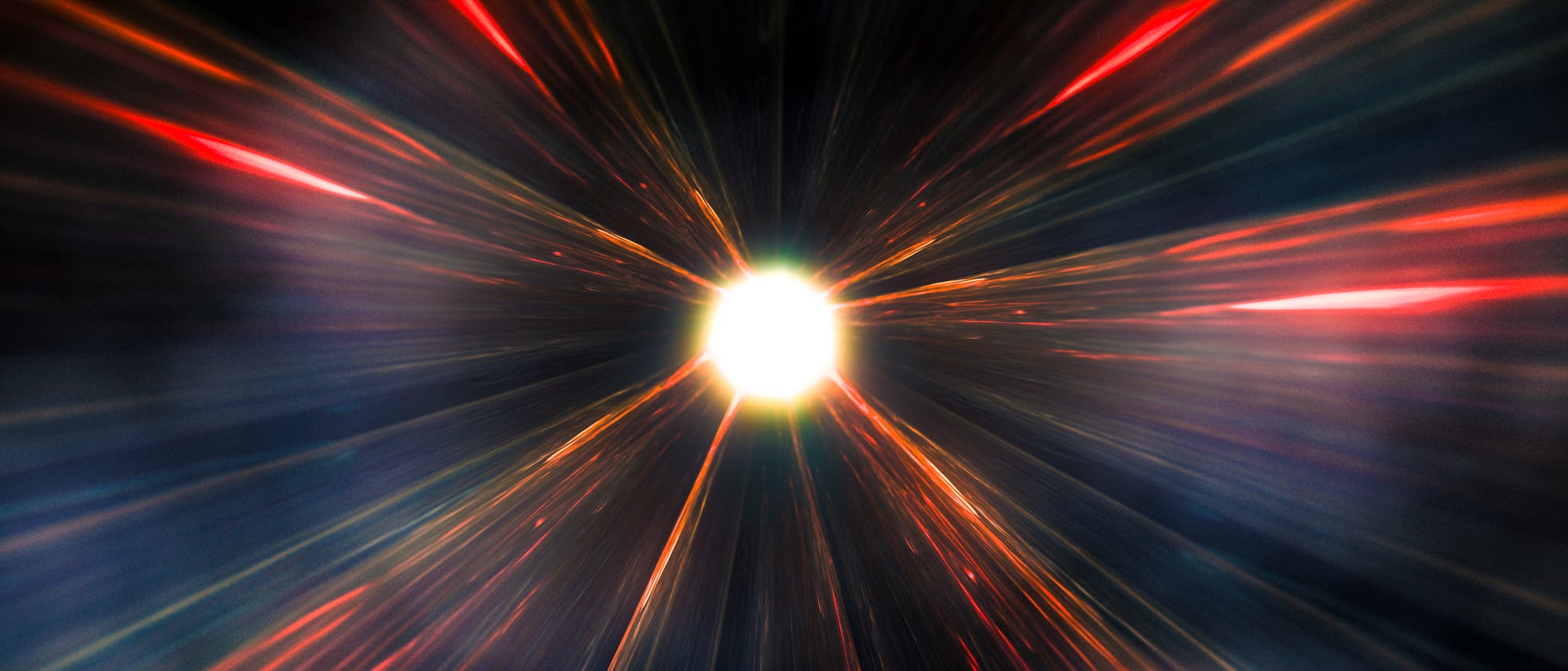 Impresión artística de un fenómeno astronómico que se asemeja a una supernova o una explosión de luz en el espacio. Un punto brillante en el centro emite rayos de luz de colores en tonos rojos, naranjas y azules que se extienden radialmente hacia afuera. El fondo es oscuro, lo que aumenta el contraste con los colores brillantes. Impresión artística de un fenómeno astronómico que se asemeja a una supernova o una explosión de luz en el espacio. Un punto brillante en el centro emite rayos de luz de colores en tonos rojos, naranjas y azules que se extienden radialmente hacia afuera. El fondo es oscuro, lo que aumenta el contraste con los colores brillantes.