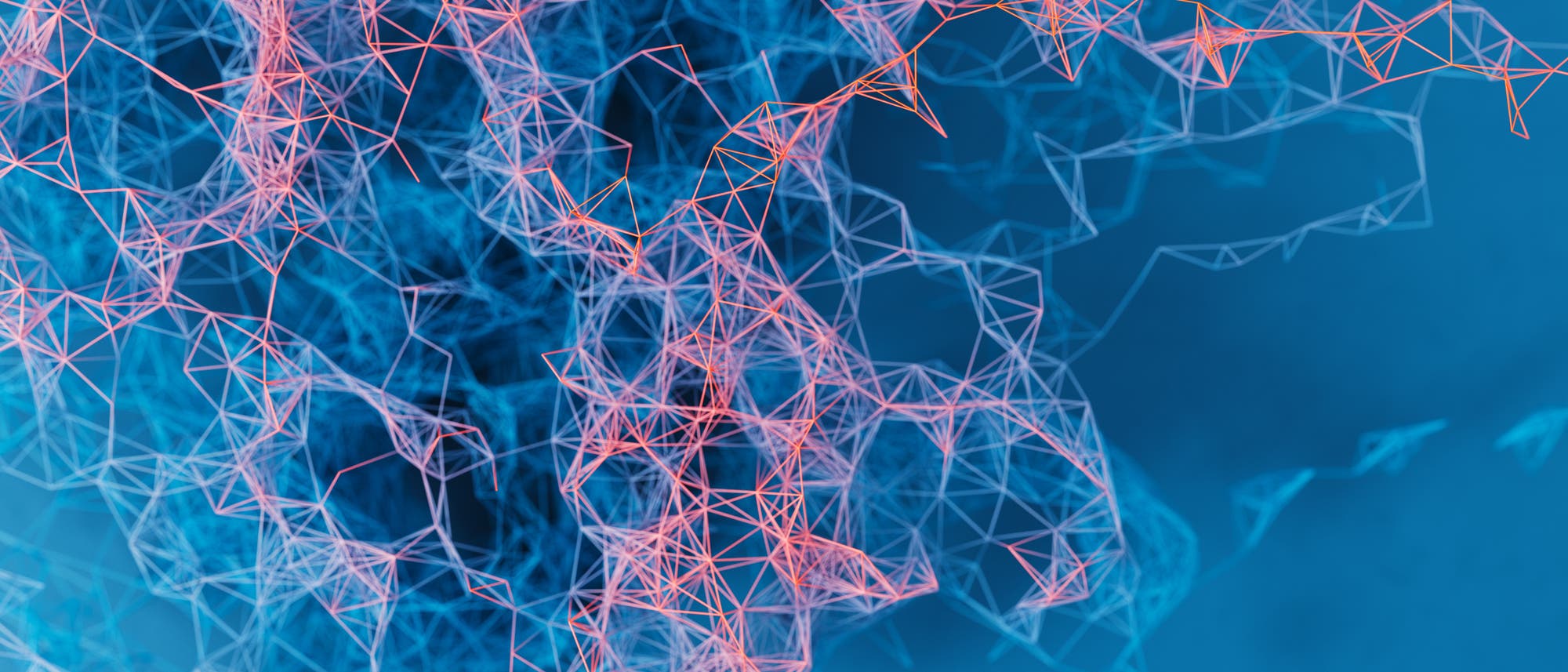 Eine 3D-Darstellung zeigt ein komplexes Netzwerk aus miteinander verbundenen Linien und Knotenpunkten. Die Linien sind in Rot und Blau gehalten und bilden ein abstraktes Muster vor einem blauen Hintergrund. Die Struktur erinnert an ein neuronales Netzwerk oder ein molekulares Modell, das die Vernetzung und Interaktion zwischen den Elementen visualisiert.