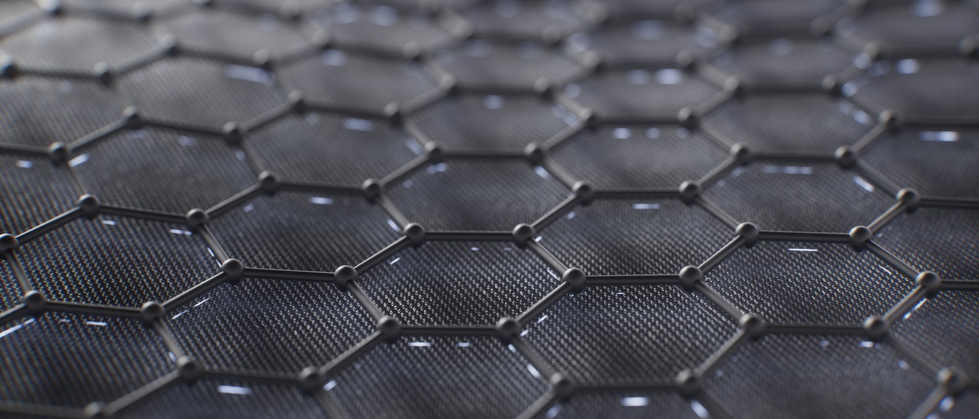 Eine 3D-Darstellung einer hexagonalen Gitterstruktur, die an ein Netz aus verbundenen Knotenpunkten erinnert. Die Oberfläche ist dunkel und reflektiert leicht das Licht. Eine 3D-Darstellung einer hexagonalen Gitterstruktur, die an ein Netz aus verbundenen Knotenpunkten erinnert. Die Oberfläche ist dunkel und reflektiert leicht das Licht.