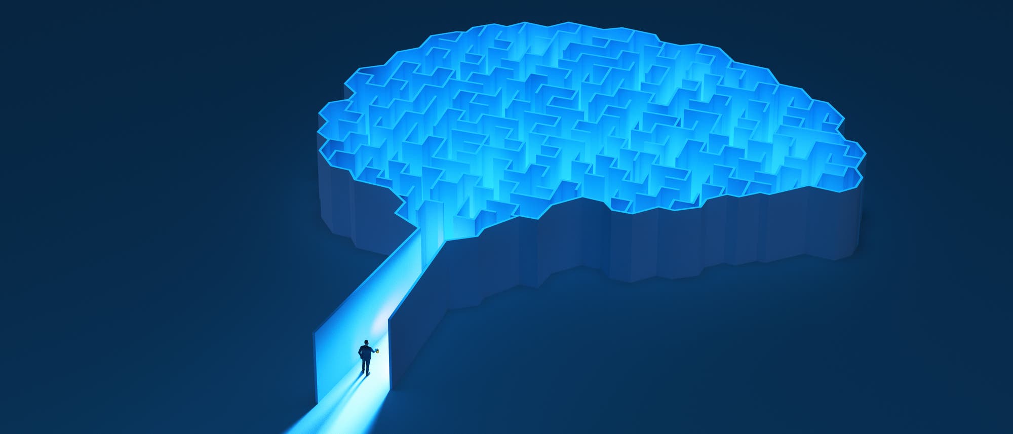 Ein stilisiertes Bild eines Gehirns, das als Labyrinth dargestellt ist. Eine Person steht am Eingang des Labyrinths, beleuchtet von einem blauen Lichtstrahl, der aus dem Inneren des Gehirns kommt. Das Bild symbolisiert die Erkundung und das Verst&auml;ndnis komplexer Gedankenprozesse.