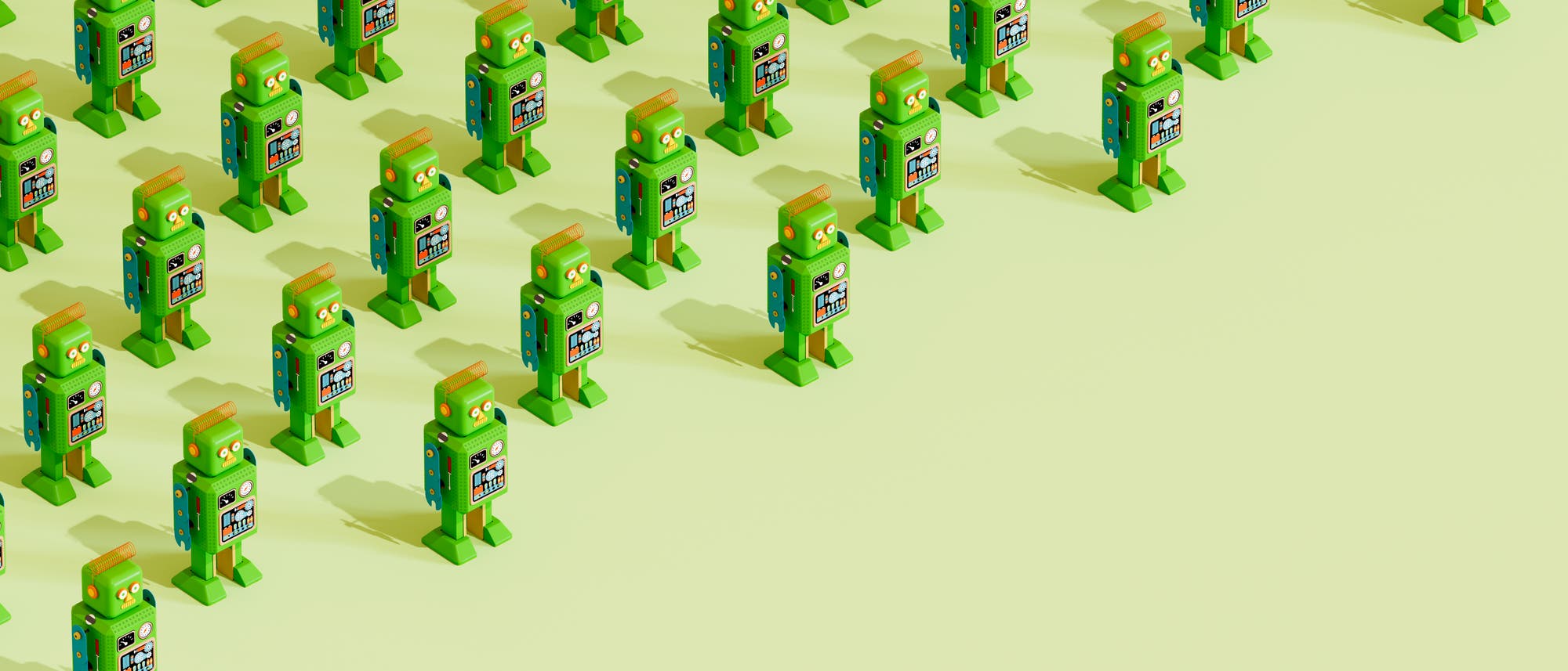 Eine 3D-Darstellung zeigt eine Gruppe von grünen, roboterähnlichen Figuren, die in einem gleichmäßigen Raster auf einem hellen Hintergrund angeordnet sind. Jede Figur hat ein rechteckiges Gesicht mit runden Augen und ein buntes Muster auf der Brust. Die Anordnung der Figuren vermittelt ein Gefühl von Ordnung und Wiederholung. Eine 3D-Darstellung zeigt eine Gruppe von grünen, roboterähnlichen Figuren, die in einem gleichmäßigen Raster auf einem hellen Hintergrund angeordnet sind. Jede Figur hat ein rechteckiges Gesicht mit runden Augen und ein buntes Muster auf der Brust. Die Anordnung der Figuren vermittelt ein Gefühl von Ordnung und Wiederholung.