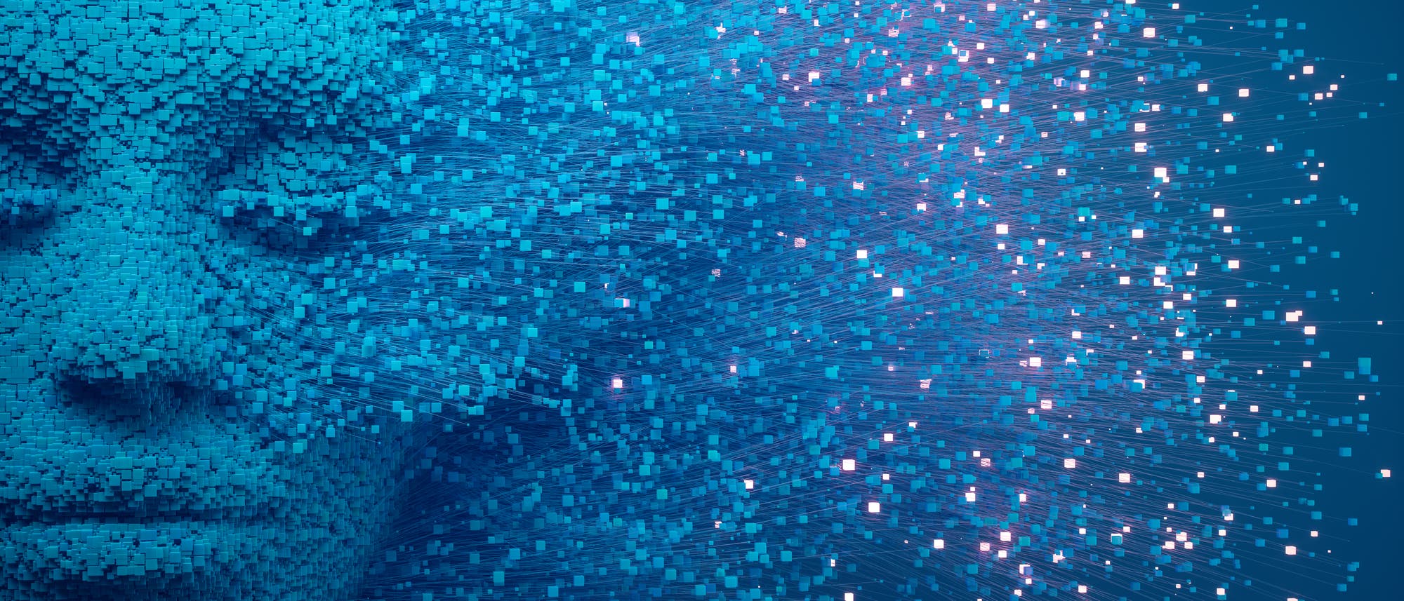 Eine 3D-Darstellung eines Gesichts, das aus zahlreichen kleinen, blauen Quadraten besteht. Die Quadrate l&ouml;sen sich auf der rechten Seite in den Raum auf und erzeugen einen dynamischen Effekt. Die Darstellung vermittelt ein Gef&uuml;hl von Digitalisierung und Datenfluss. Der Hintergrund ist in einem dunklen Blau gehalten, was den Kontrast zu den helleren Quadraten verst&auml;rkt.